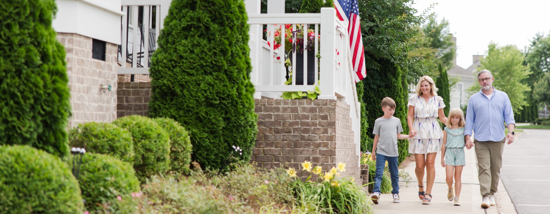 grandparents and grandchildren walking in the Berry Farms neighborhood of Franklin Tennessee just outside of Nashville